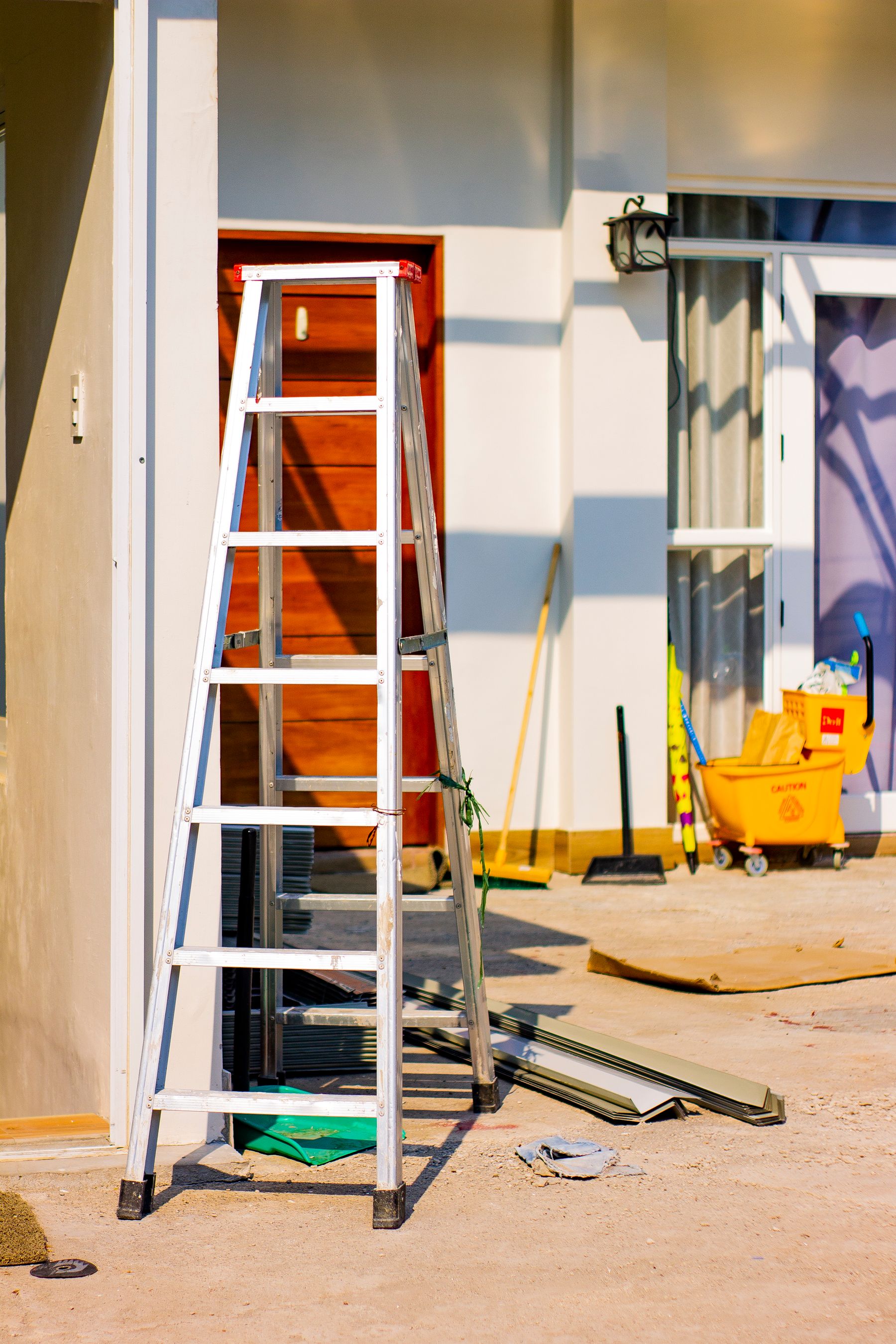Home renovation site with ladder and tools
